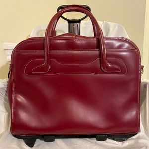 Mcklein Leather Laptop Bag W/ Detachable Rollers and attached rain fly